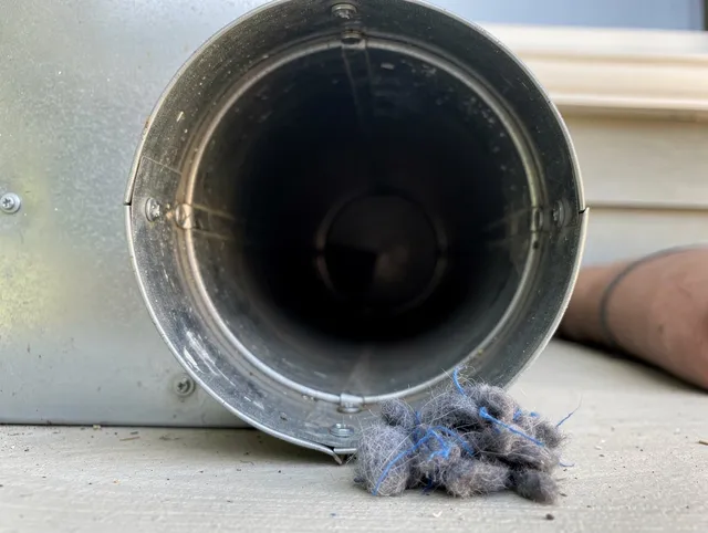 Glendora Dryer Vent Cleaning technician using specialized equipment to clear severe dryer vent blockage in Glendora